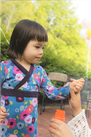 main photo of Cleared snapshot; Young girl playing outside