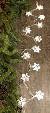 main photo of 6' snowflake stringer on white sheer ribbon