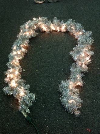 main photo of 9' section of silver tinsel garland