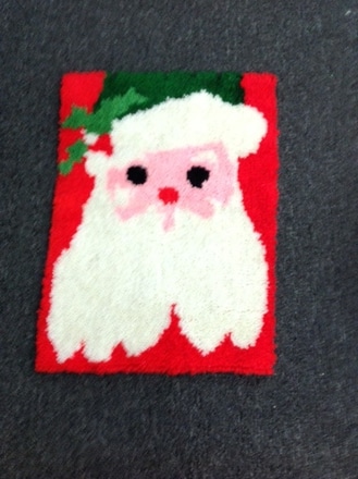 main photo of Handmade Santa face rug. 27" x 19"