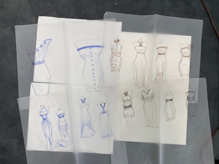 main photo of fashion sketches on tracing paper