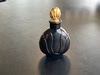 Black Perfume Bottle w/Ribbing. Gold Stopper