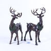 Dark Brown Reindeer Adorned With Green Wreath
