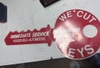 Vintage Key-Shaped Advertising Sign