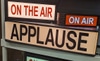 Applause sign - white background, black lettering