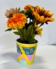 Faux flowers in homemade pot