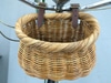Wicker bicycle basket with two faux leather buckled straps