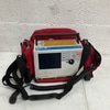 Portable Cardiac Monitor with Red Carrying Case