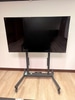 Rolling TV Stand With 65" TV