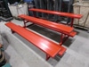 7' 6 1/2"w x 58"d painted red aluminum bleachers & foot rails