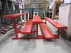 7' 6 1/2"w x 58"d painted red aluminum bleachers & foot rails