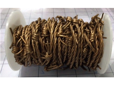 main photo of Rubber - Copper Barbed Wire