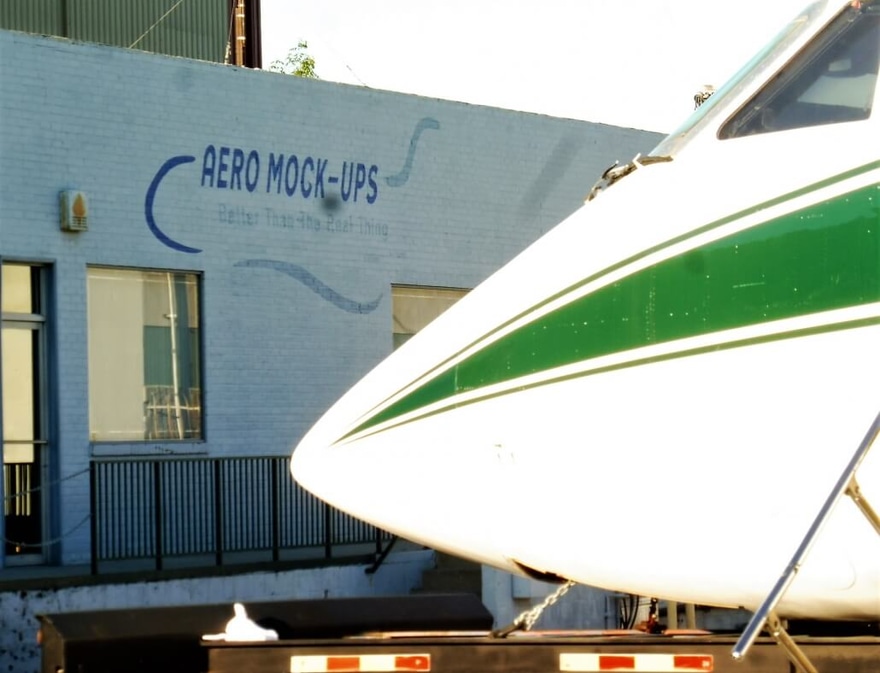Nose of an Executive Jet in front of Aero Mock-Ups