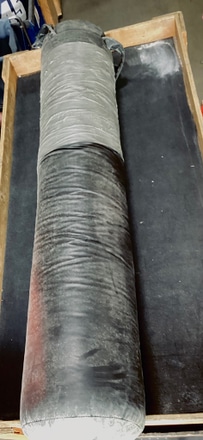 main photo of Black weathered punching bag w/duct tape