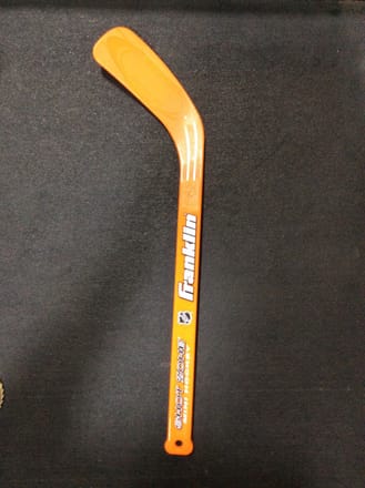 main photo of Plastic Kids Hockey Stick Orange 19" tall