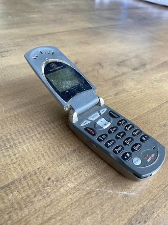 main photo of grey flip phone