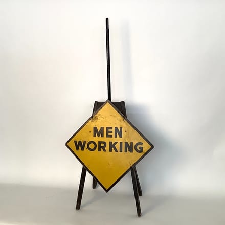 main photo of Men Working Sign