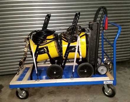 Two heaters and a breaker panel on a flatbed cart